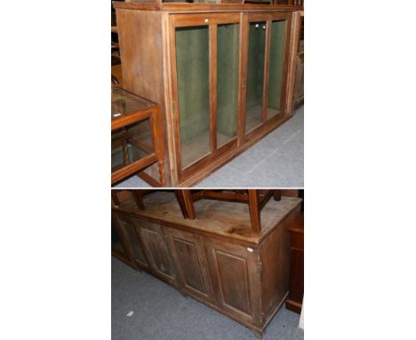 A late 19th century glazed and sliding door pine cabinet, the interior lined in green fabric and with twelve bridle hooks, 20