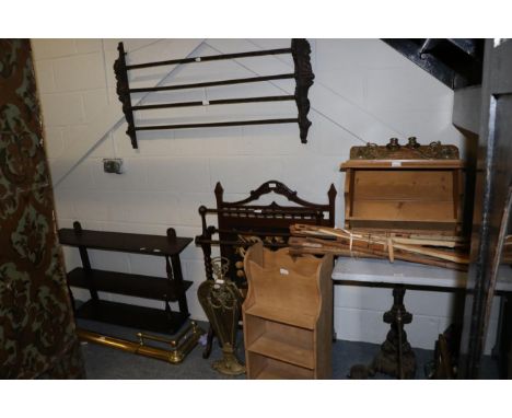 A square table with cast base, two wall shelves, a wall mounted reading table, a book rack, fire curb, fire screen, brass fir