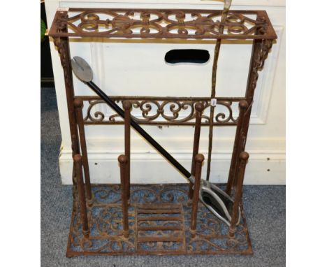 A metal combination stick stand and boot rack