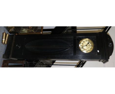 An ebonised oak longcase clock