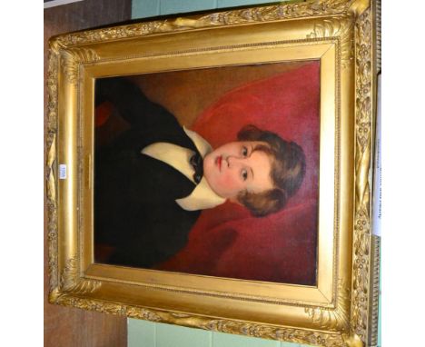 British School, 19th Century, Portrait of a young boy, half length, in a black coat, oil on canvas, the gilt frame with inscr