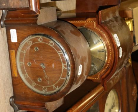 A mahogany wall clock and two mantle clocks