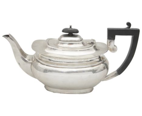 A George V silver teapot Sheffield, 1926 by Charles Henry Hattersleyof oblong bellied form, fitted with an ebonised scroll ha