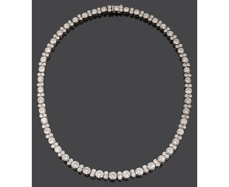 An impressive diamond necklace, composed of a flexible graduated row of 46 brilliant-cut diamonds collets, each separated by 