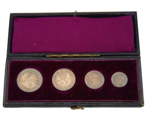 A Victorian silver Maundy set dated 1880 in a fitted case,with a young head portrait of Victoria, case embossed with gilt let