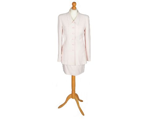 A pale pink Chanel skirt suitjacket with four patch pockets to front, button fastening with six double C logo buttons and fou