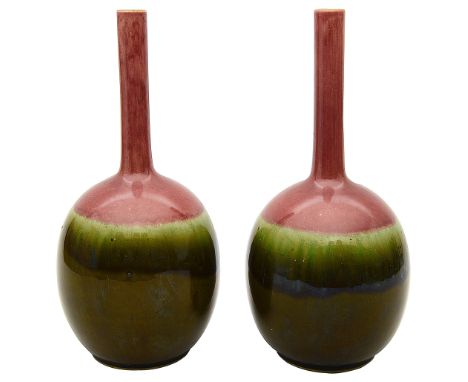 A pair of late 19th century Art Pottery bottle vasespossibly Ault or Linthorpe of ovoid form with a slender neck, decorated i