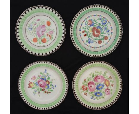 Four early 19th century Welsh pottery ribbon plates c.1820each with green basketweave border and pierced brown painted rims, 