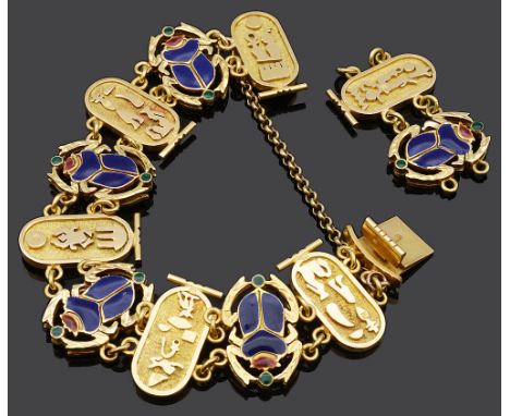 An Egyptian revival style yellow metal and enamel scarab braceletthe pierced and enamel scarab panels alternating with stylis