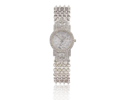 Corum. An 18ct white gold and diamond set bracelet watch  Case Numbers 30.127.59/524135, Movement number 328661, Circa 1990 J