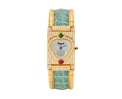 Kutchinsky. An 18ct gold, diamond, ruby and emerald quartz bangle watch  Circa 1990 Quartz movement, trefoil shaped silvered 