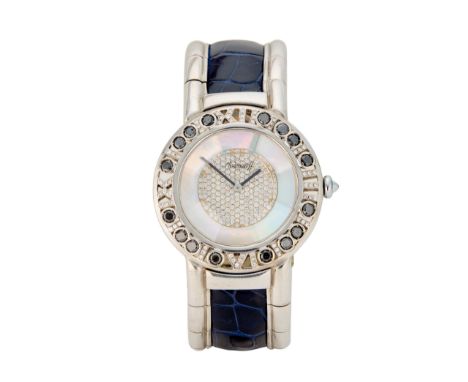 Swiss. An 18ct white gold and black diamond set bangle watch  Romus, Circa 1990 Quartz movement, round mother-of-pearl dial w