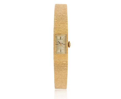 Bucherer. An 18ct gold yellow bracelet watch  Circa 1960, with Swiss gold marks 17-jewel manual wind movement, textured integ