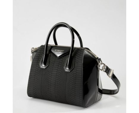 Givenchy. Antigona Tote, of black python and patent leather and silver hardware, the python leather to the front, back and ba