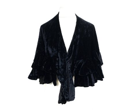 A vintage Woolland Bros black velvet capelet 