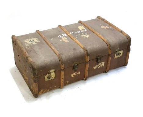 A vintage wood banded travel trunk, with stickers, with top marked JR Corrie, bear plaque '"Burne" Guaranteed Plywood Through