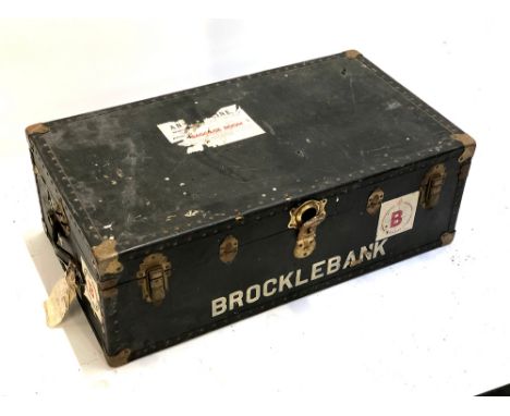 A vintage travel trunk with stickers, bears name 'Brocklebank', 92cm wide 