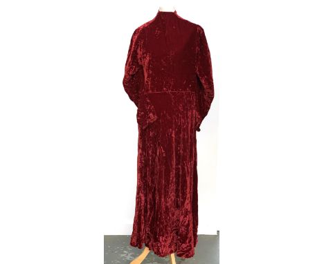 An early 20th century Debenham &amp; Freebody red velvet dress with tie 