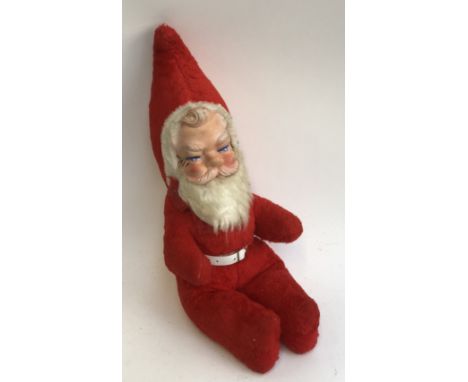 A vintage stuffed Father Christmas toy 