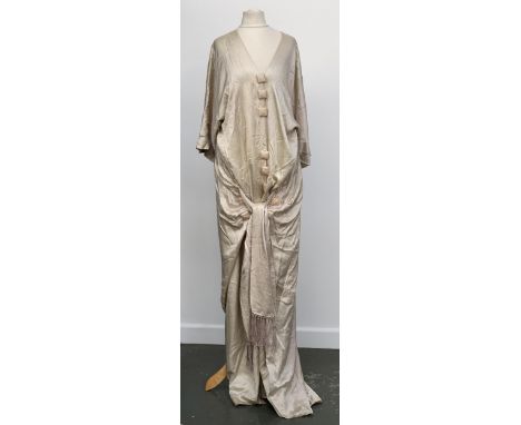A 1920s silk day gown, with large square silk covered buttons with embroidered and sash tie 
