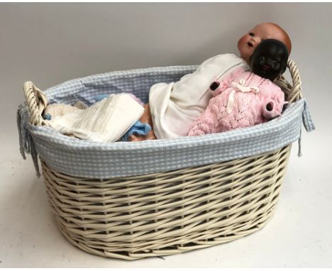 An Armand Marseille doll, porcelain head and composition body, stamped 351./.5.K, with closing eyes; together with a German b
