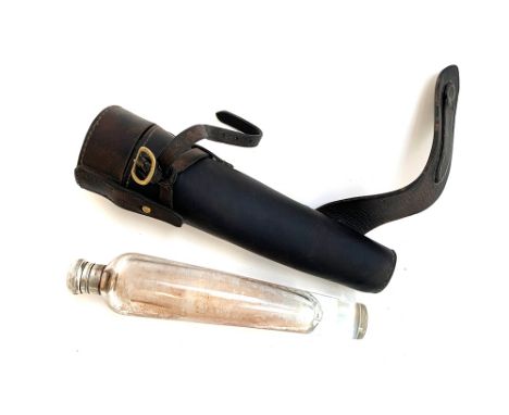 A conical glass hunting flask, in leather holster with saddle furniture, 26cm long 