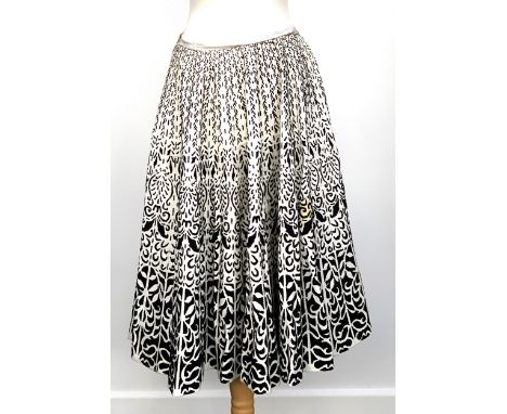 A vintage home made white cotton skirt with black flock pattern detail 