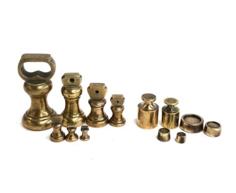 A collection of vintage brass weights, from 1lb downwards 