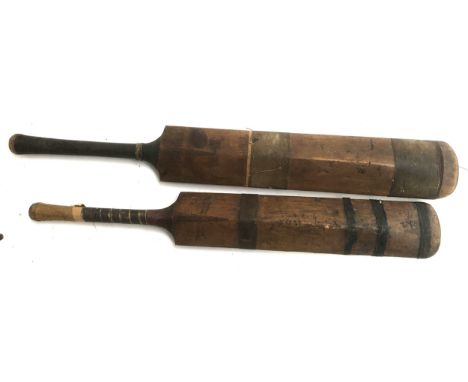 A pair of vintage cricket bats: 'The Champion' by Stuart Surridge &amp; Co, and 'The Marathon' by Wainwright (2) 
