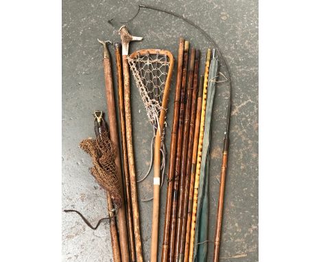 A mixed lot to include antler and hazel walking stick, vintage lacrosse stick, bamboo rods, silver topped cane, window hook, 