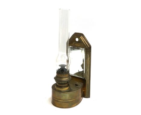 Local Interest: A wall mounted brass oil lamp, with glass chimney and bevelled mirrored plate, bearing plaque to reverse 'Ex 