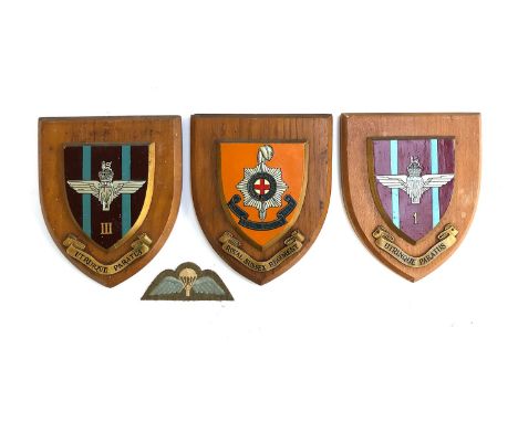 Two British Parachute Regiment wooden plaques bearing the motto 'UTRINQUE PARATUS', each 15cmW; together with a Royal Sussex 