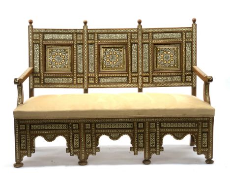 An Anglo-Indian upholstered bench, 20th century, all over geometric bone and mother of pearl inlay, suede upholstered seat, 1