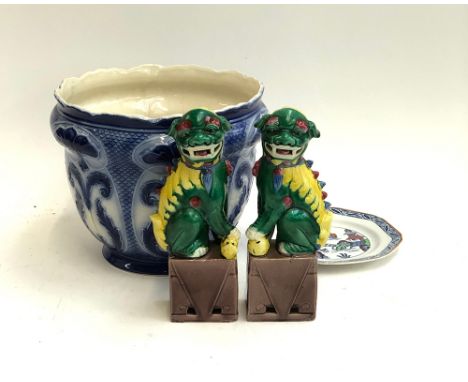 A pair of colourful Chinese decorative foo dogs; saucer; and planter 