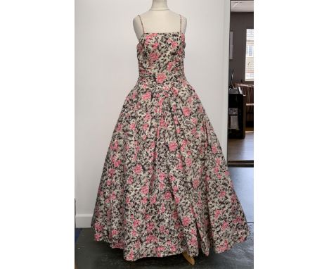 A vintage Frank Usher ball gown with rose pattern fabric, approx. size 6-8; together with a vintage green ball gown 