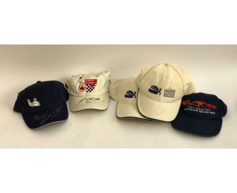 An Air Canada Grand Prix cap signed by R Schumacher; a Mitchelin cap with unknown signature; a 1998 Australian Gran Prix cap;
