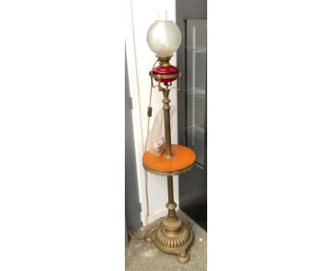 A standing oil lamp with ruby glass reservoir, with chimney and shade, converted for electrical use, approx. 162cmH 