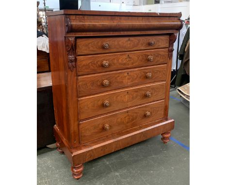 A massive Victorian North Country mahogany chest of drawers, cushion drawer over five graduating drawers, on architectural pl