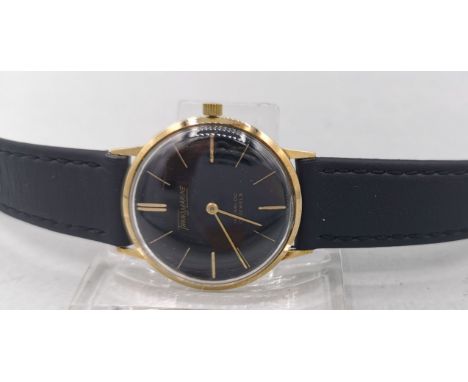 GOLDENE VINTAGE ARMBADUHR, Schweiz, Handaufzug, "Transmarine" - Nicolet Watch SA / Schweiz. Rundes Goldgehäuse an schwarzem L