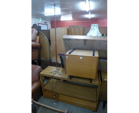 A Danish Nipu teak cabinet, standard lamp and a metamorphic serving table