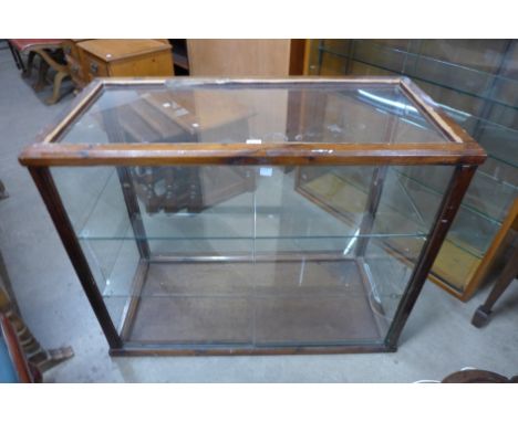 An early 20th Century beech shop display cabinet