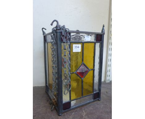 A brass and stained glass lantern 