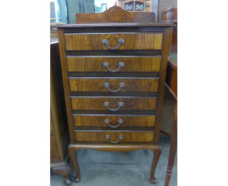 A walnut music cabinet