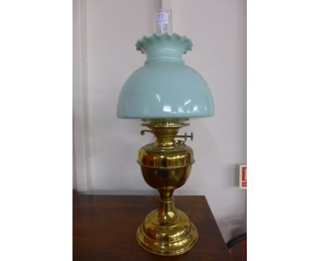 A Victorian style brass oil lamp