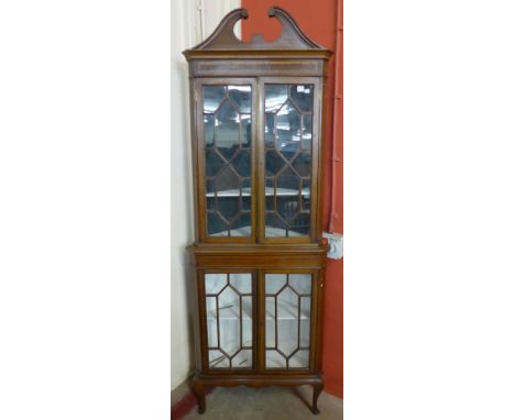 An Edward VII inlaid mahogany freestanding corner cabinet