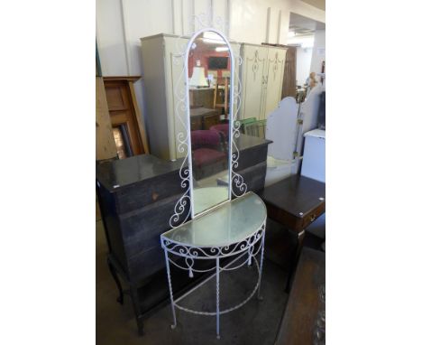 A wrought iron console table and mirror