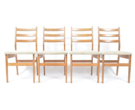 A set of 4 mid century, circa 1960's beech wood Danish influenced set of 4 dining chairs. Each being raised on squared legs w