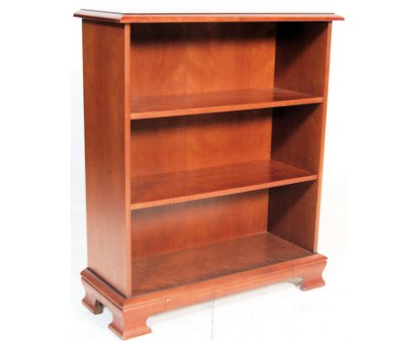 A good quality Queen Anne revival&nbsp; mahogany open window bookcase having&nbsp; a flared edge and shaped top with two adju