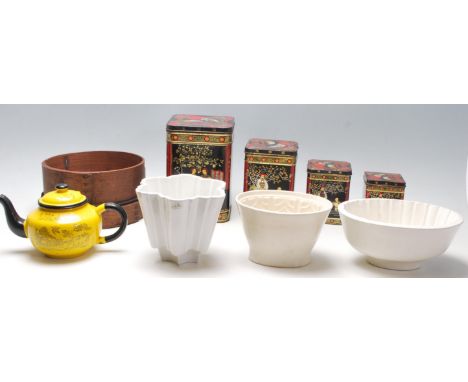 A good collection of vintage kitchenalia to include a set of four graduated tea tins with Chinese decorations, three antique 