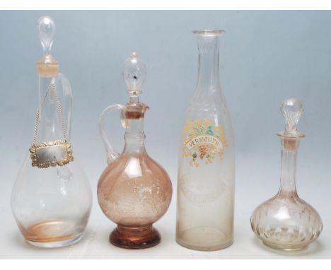 A collection of 18th century and 19th century Victorian glass decanters to include a two jug decanters complete with stoppers